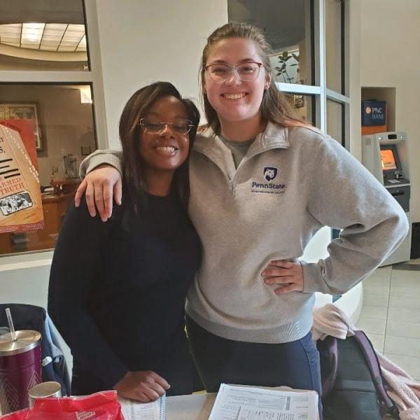 Wagner, pictured right, registers voters in the HUB through her role with NextGen, along with NextGen colleague and Penn State a